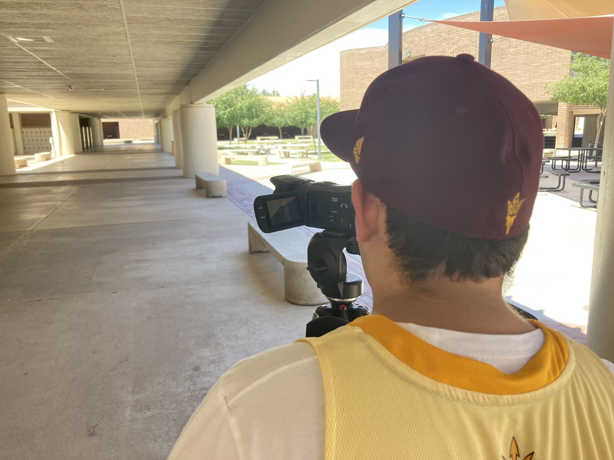 A picture of Daniel Casillas in-front of a camera